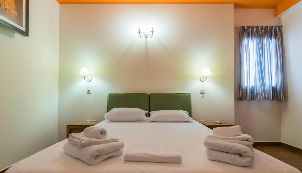 Postel nebo postele na pokoji v ubytování Malion Rooms