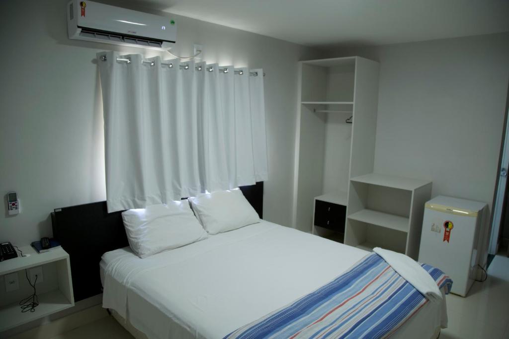 Ліжко або ліжка в номері Hotel Macapaba