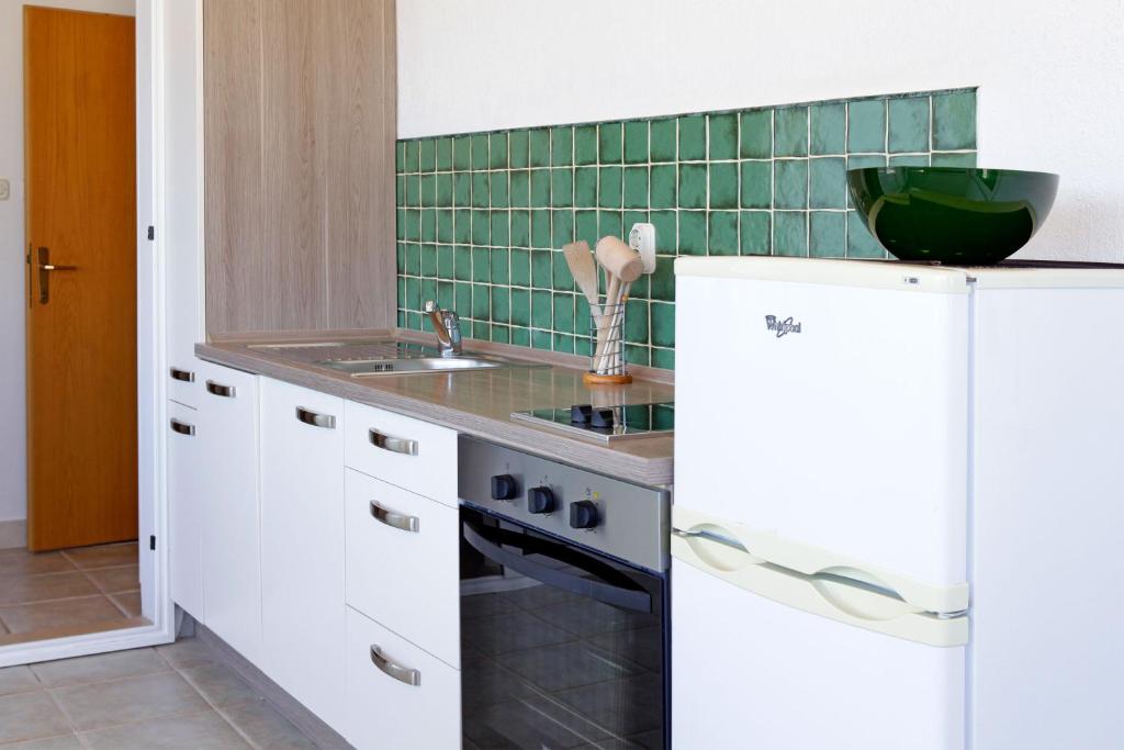 Kuchyň nebo kuchyňský kout v ubytování Apartments Mel