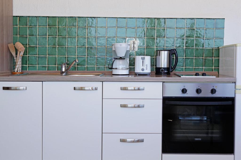 Kuchyň nebo kuchyňský kout v ubytování Apartments Mel