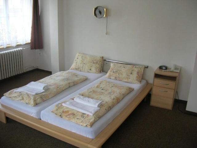 Postel nebo postele na pokoji v ubytování Hotel Slovan