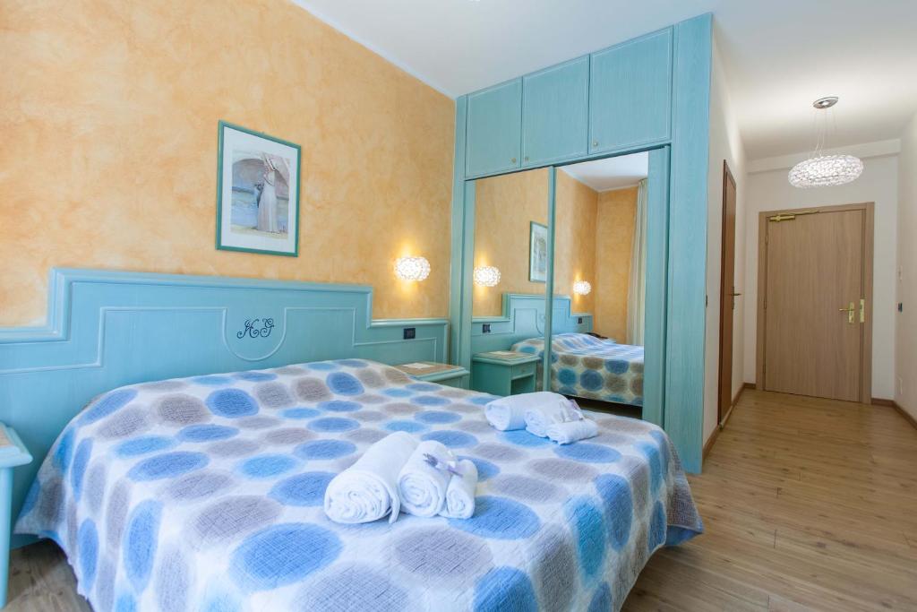 Postel nebo postele na pokoji v ubytování Grand Hotel Gortani