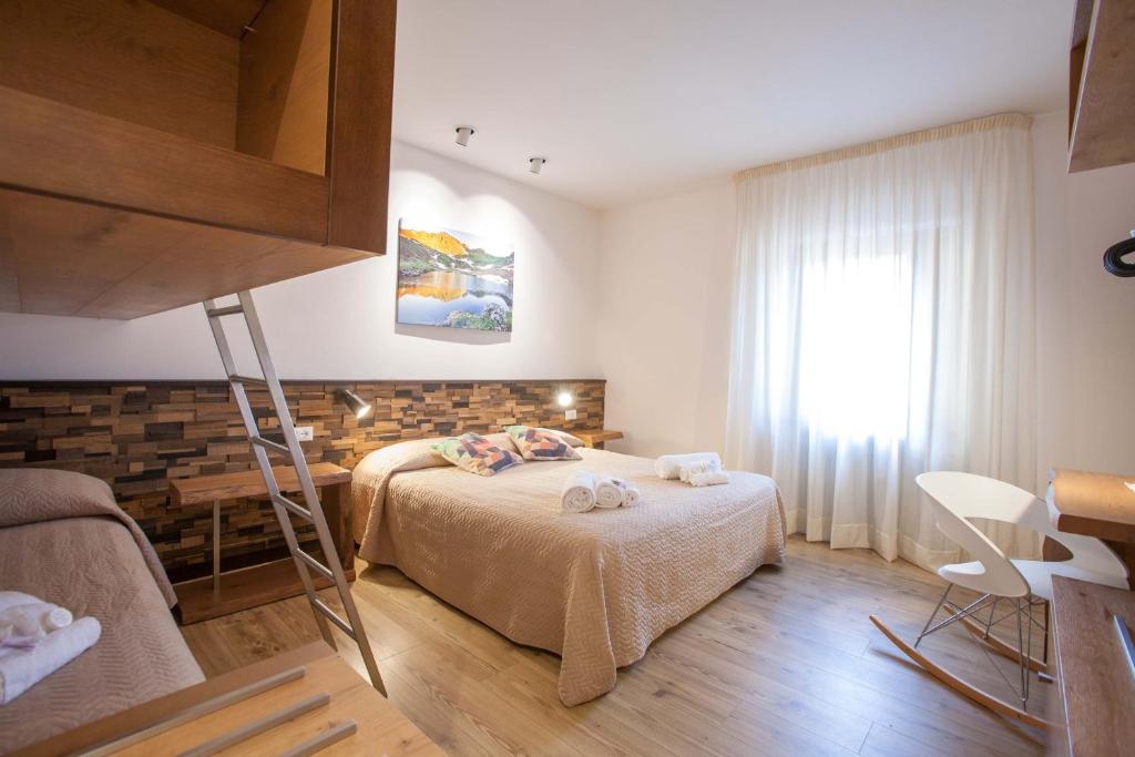 Postel nebo postele na pokoji v ubytování Grand Hotel Gortani