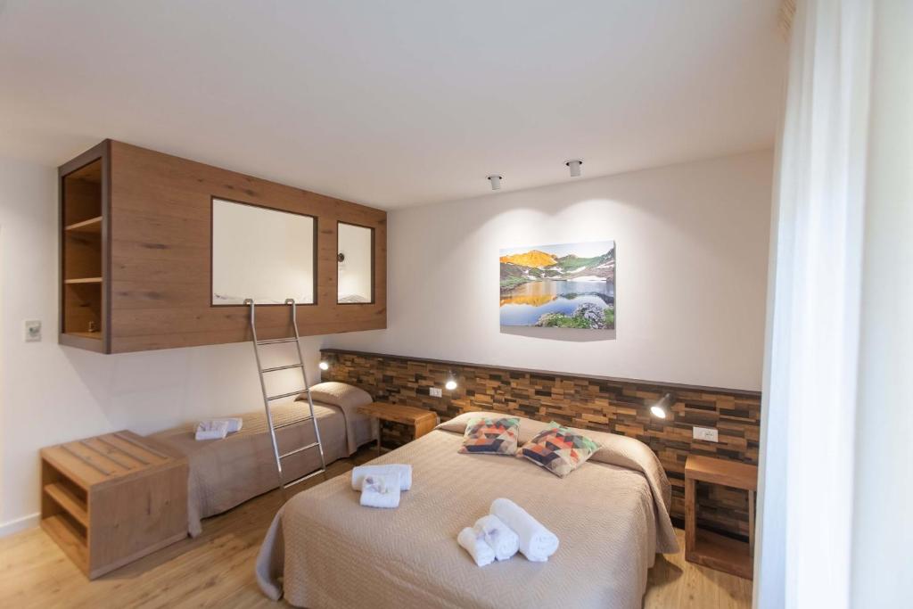 Postel nebo postele na pokoji v ubytování Grand Hotel Gortani