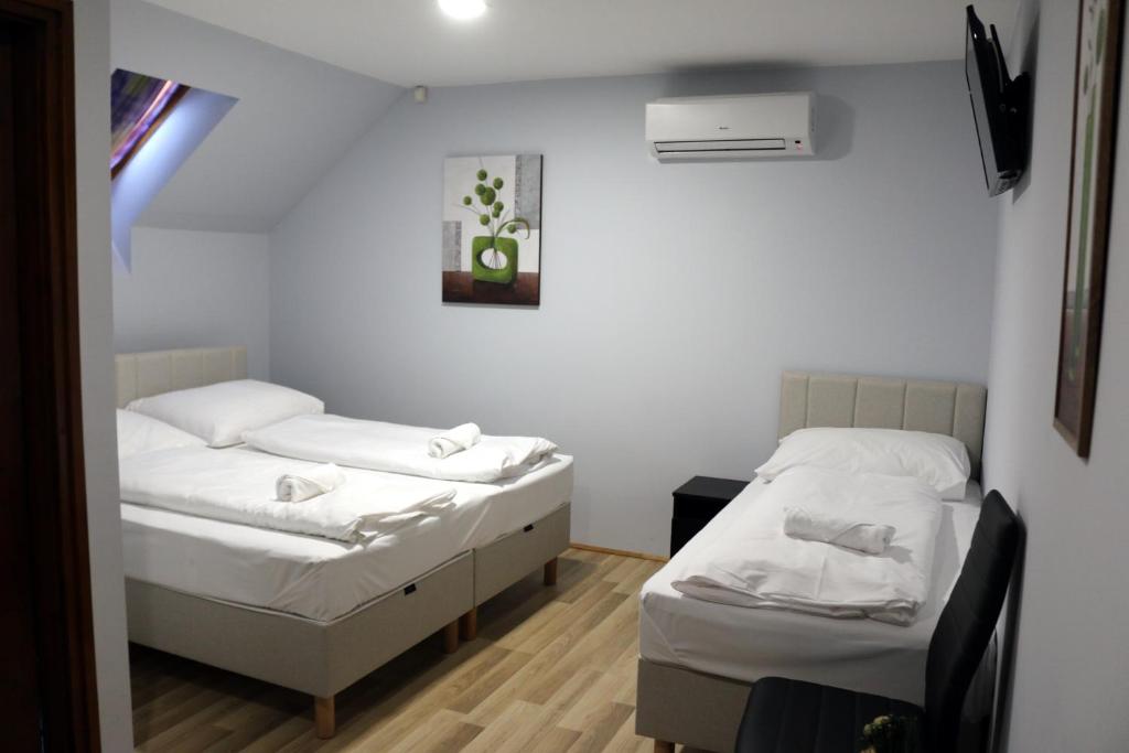 Postel nebo postele na pokoji v ubytování Sörpatika Vendégház