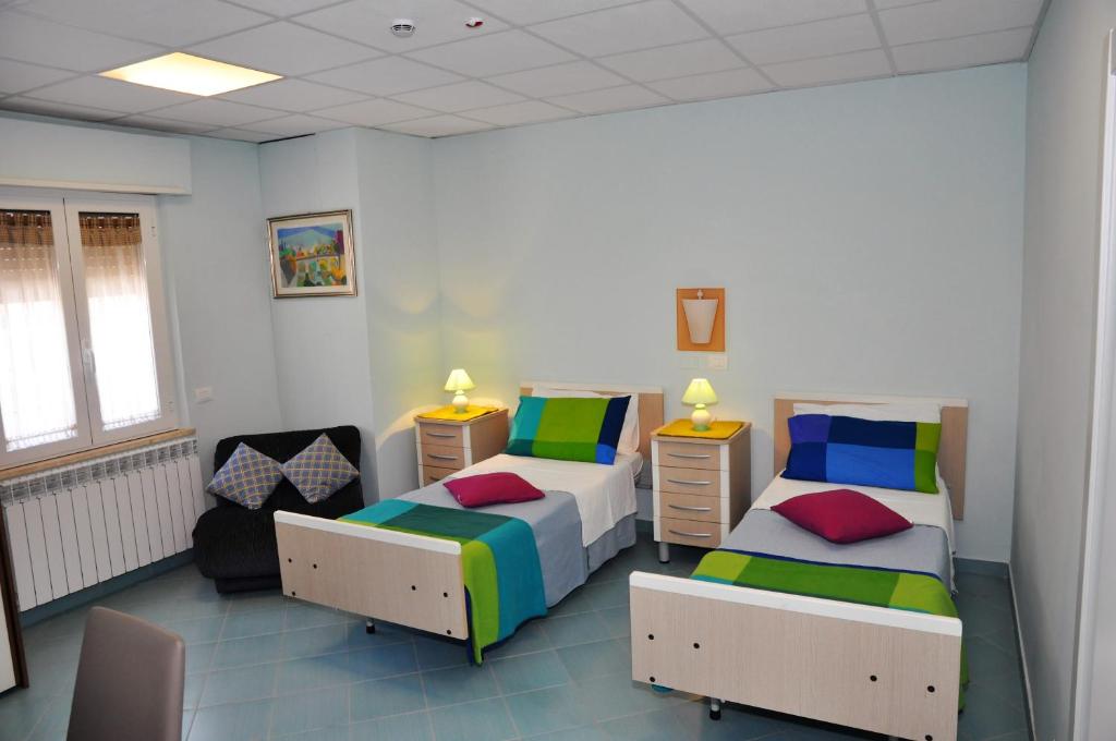 Postel nebo postele na pokoji v ubytování Albergo Rio