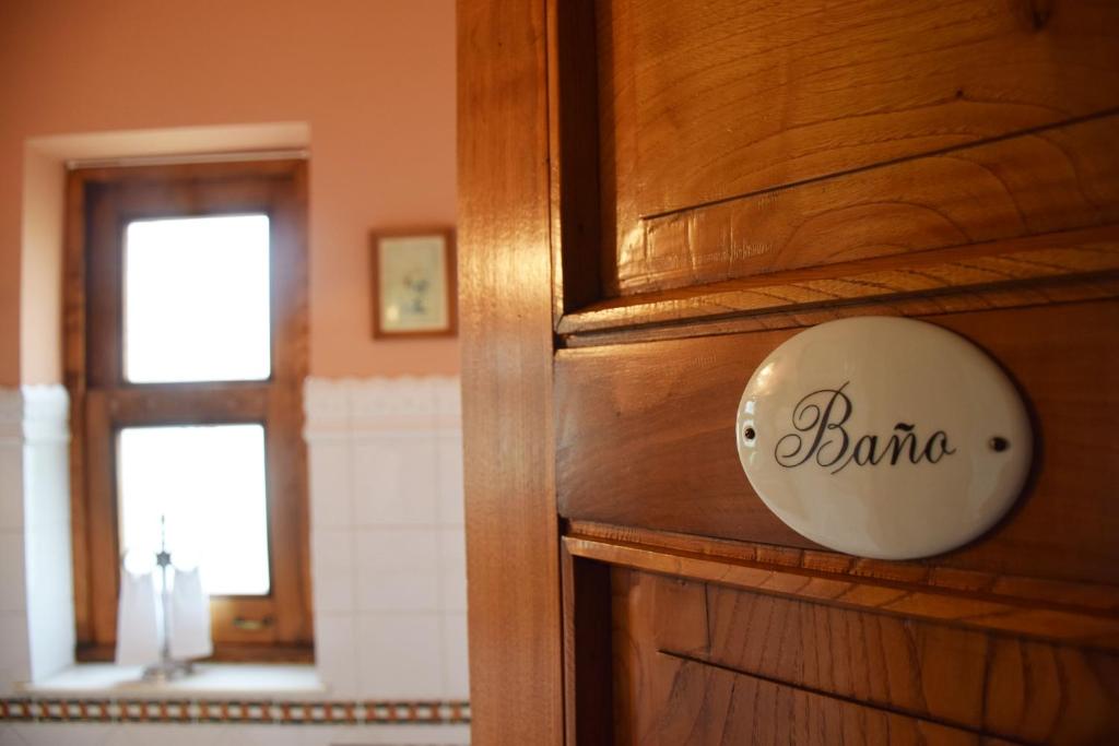 a wooden door with a sign that says barma on it at Hotel Hontoria in Hontoria