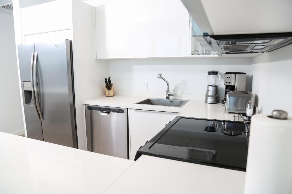 Kuchyň nebo kuchyňský kout v ubytování Blue Residences