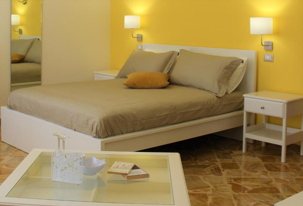 Postel nebo postele na pokoji v ubytování La Chiave Rossa B&B