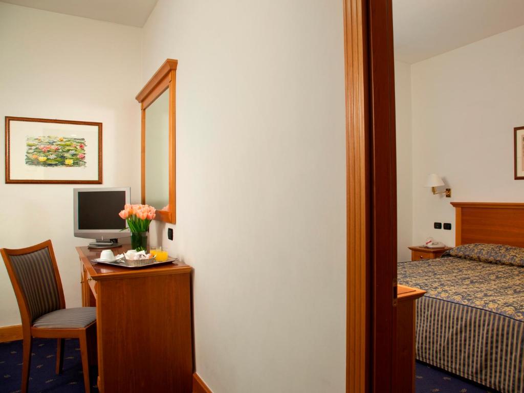Postel nebo postele na pokoji v ubytování Hotel Diplomatic