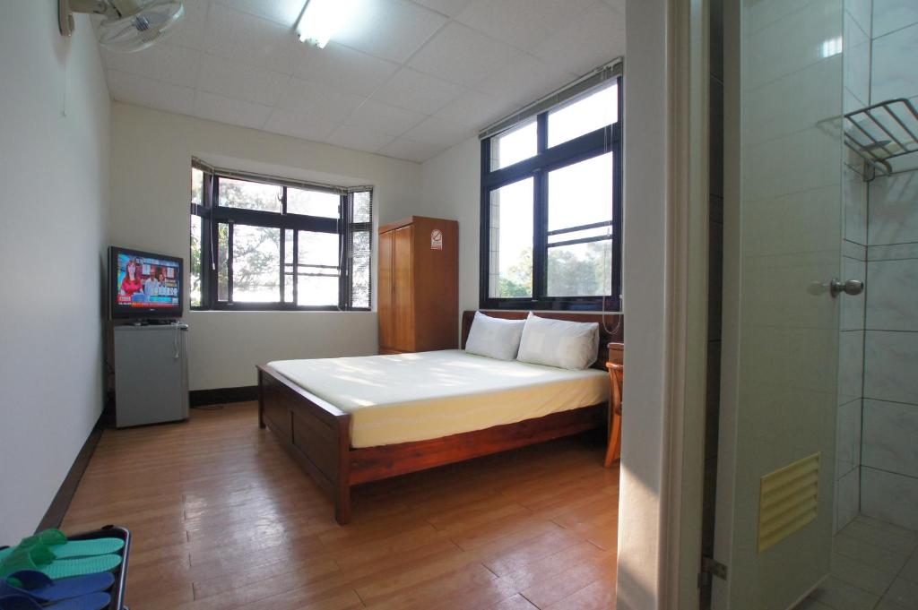Postel nebo postele na pokoji v ubytování Fumei Bluebird Homestay