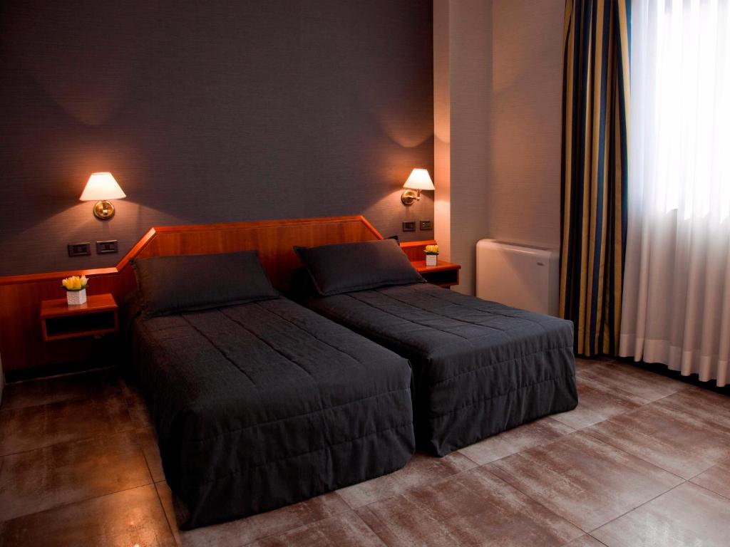 Postel nebo postele na pokoji v ubytování Hotel Zone