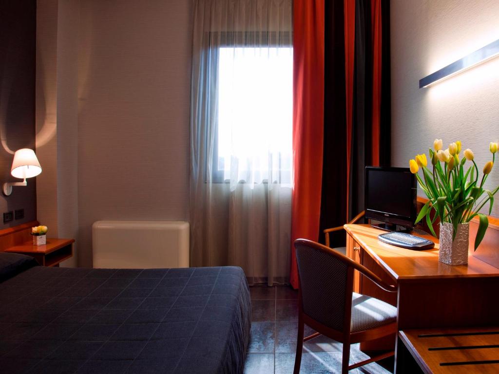Postel nebo postele na pokoji v ubytování Hotel Zone