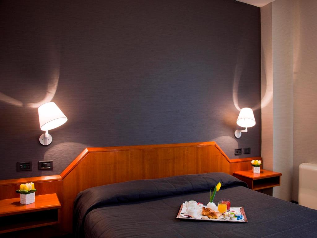 Postel nebo postele na pokoji v ubytování Hotel Zone