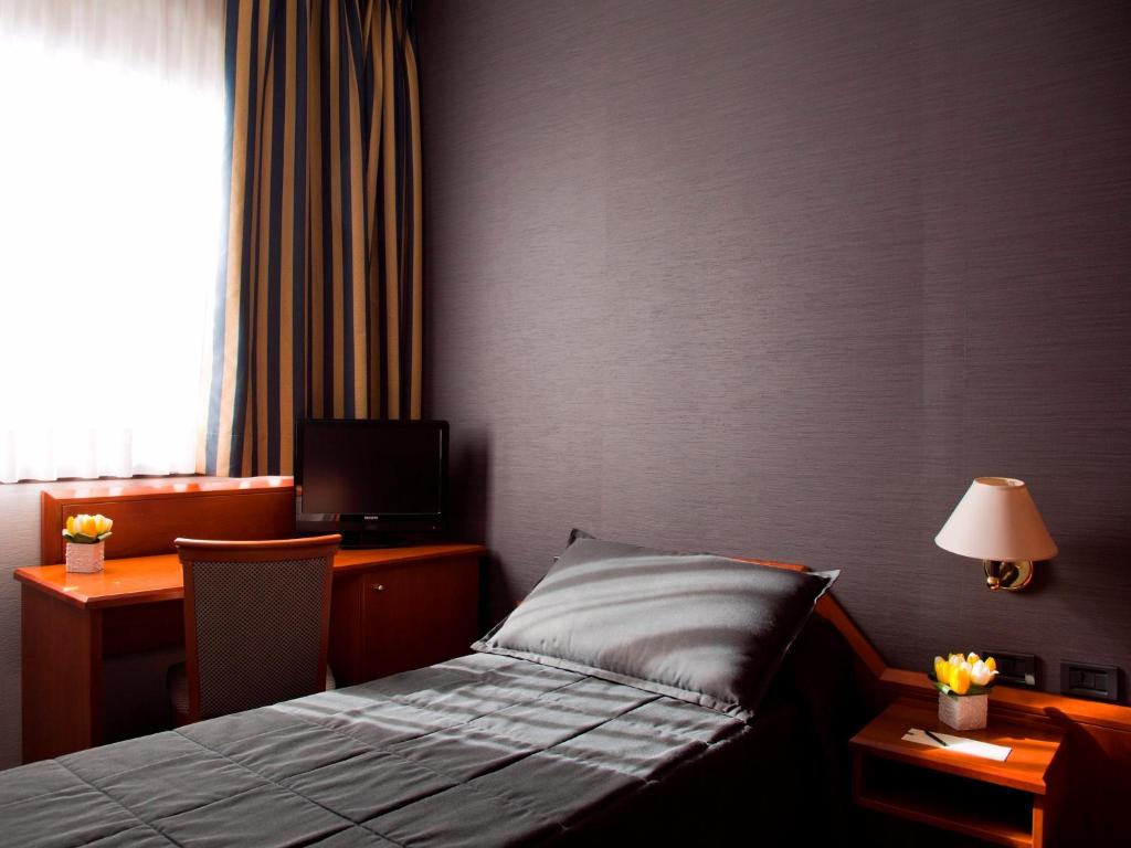 Postel nebo postele na pokoji v ubytování Hotel Zone