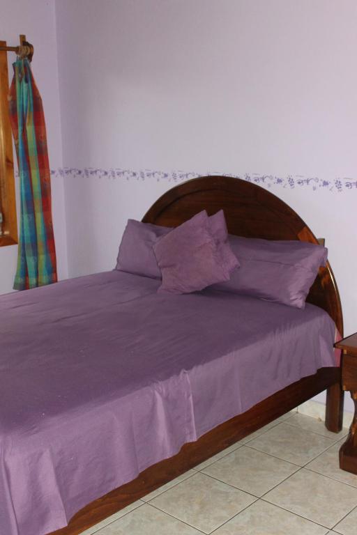 Postel nebo postele na pokoji v ubytování Rainbow Village