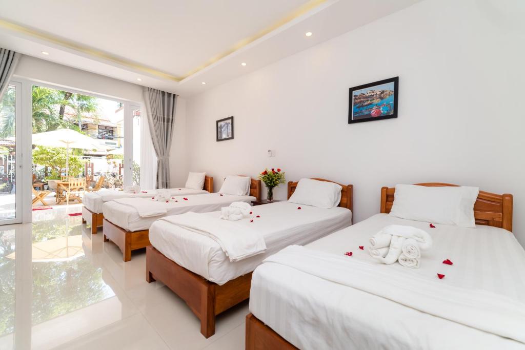 Postel nebo postele na pokoji v ubytování Horizon Homestay Hoi An