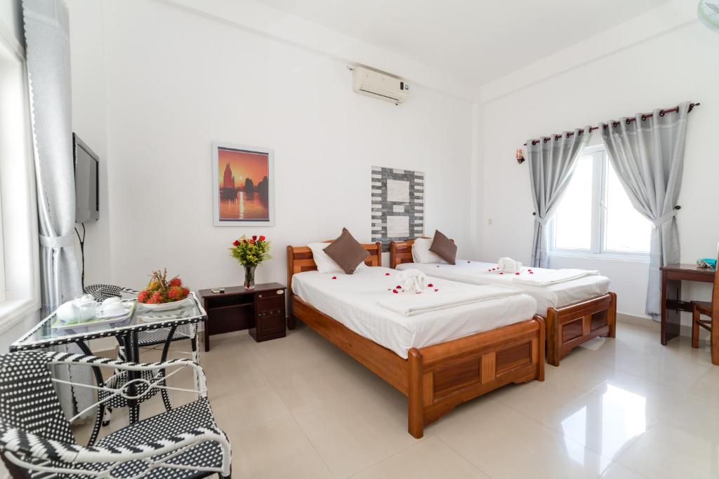 Postel nebo postele na pokoji v ubytování Horizon Homestay Hoi An
