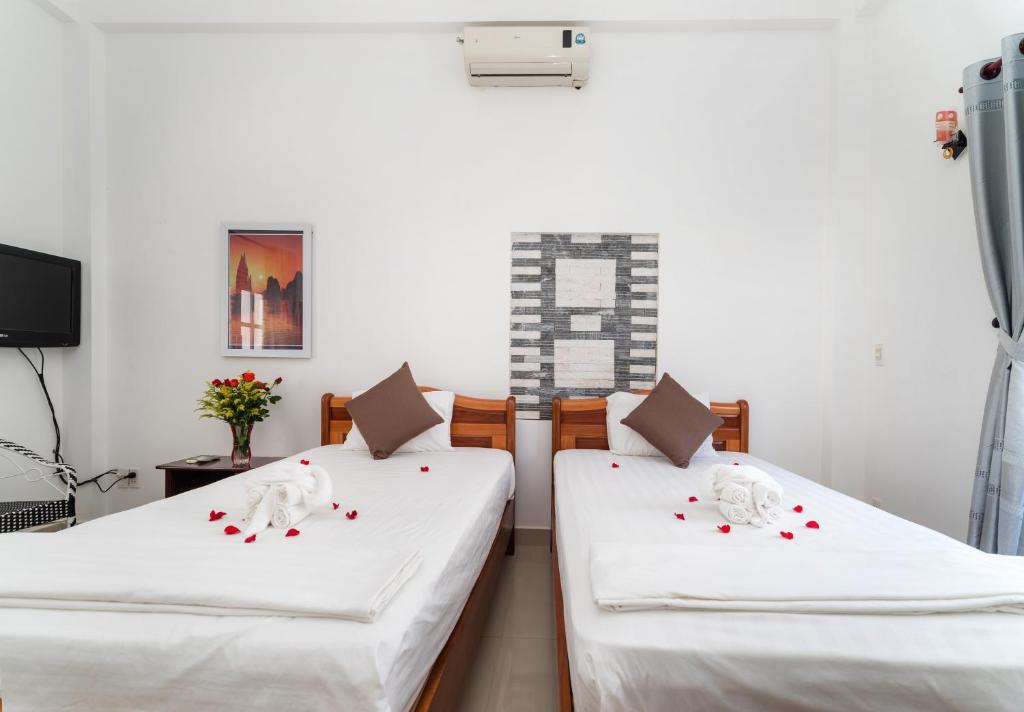 Postel nebo postele na pokoji v ubytování Horizon Homestay Hoi An