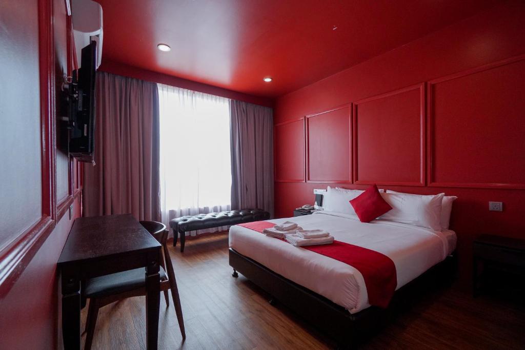 Postel nebo postele na pokoji v ubytování Bloommaze Boutique Hotel Puchong