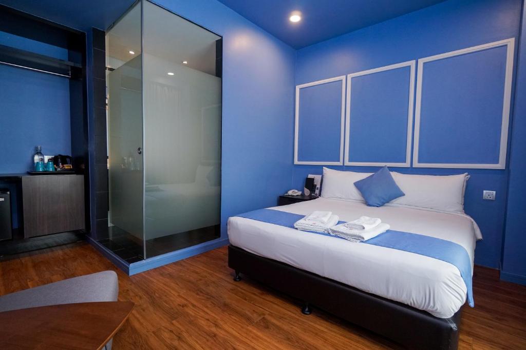 Postel nebo postele na pokoji v ubytování Bloommaze Boutique Hotel Puchong