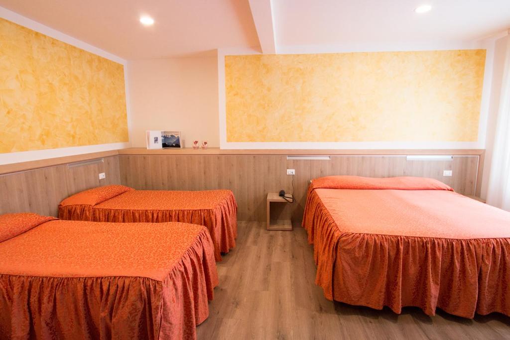 Postel nebo postele na pokoji v ubytování Al Benvenuto Hotel & Restaurant