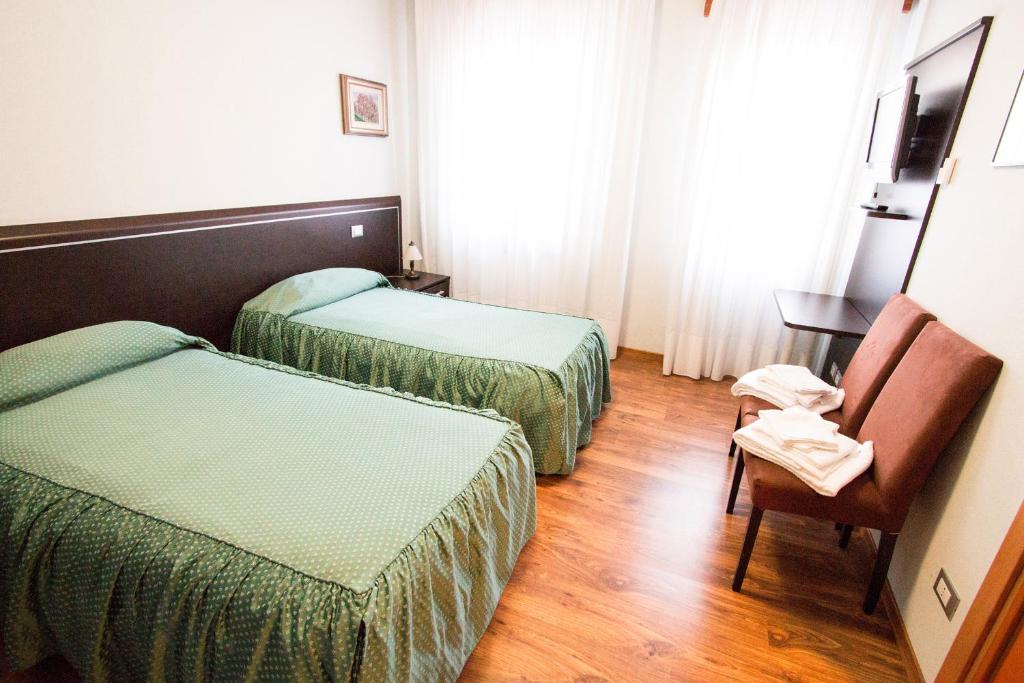 Postel nebo postele na pokoji v ubytování Al Benvenuto Hotel & Restaurant