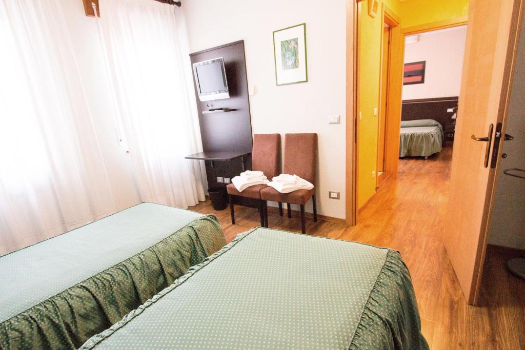 Postel nebo postele na pokoji v ubytování Al Benvenuto Hotel & Restaurant