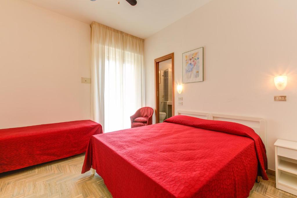 Postel nebo postele na pokoji v ubytování Hotel Splendid