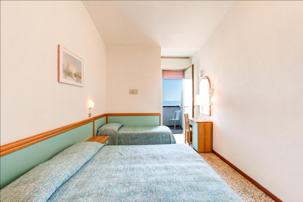 Postel nebo postele na pokoji v ubytování Hotel Splendid