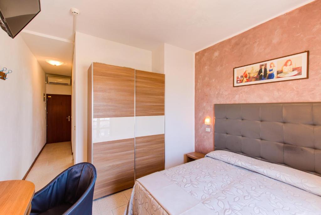 Postel nebo postele na pokoji v ubytování Hotel Splendid