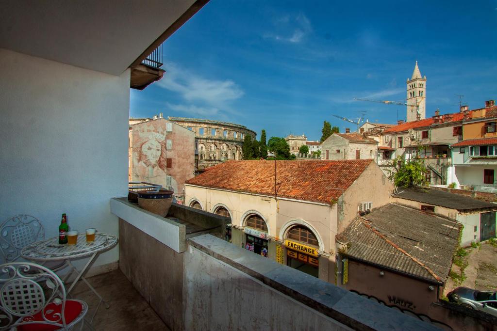 a view of a city from a balcony at Apartman Colosseum in Pula
