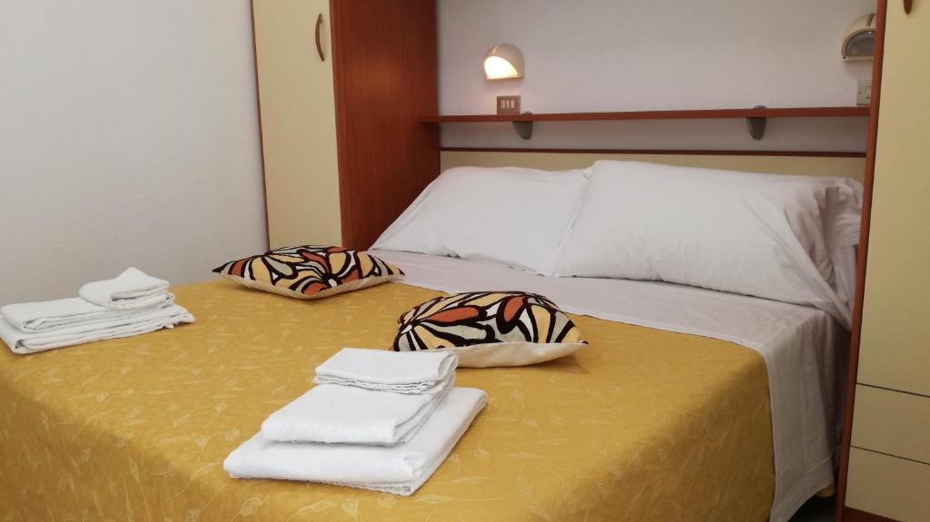 Postel nebo postele na pokoji v ubytování B&B Hotel Serenità