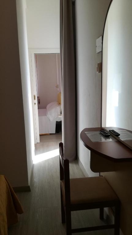 Postel nebo postele na pokoji v ubytování B&B Hotel Serenità