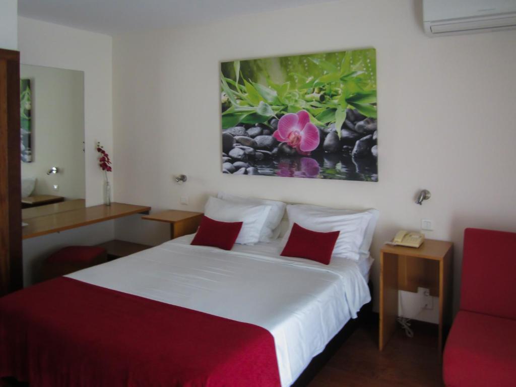 Postel nebo postele na pokoji v ubytování Hotel Eco Salvador
