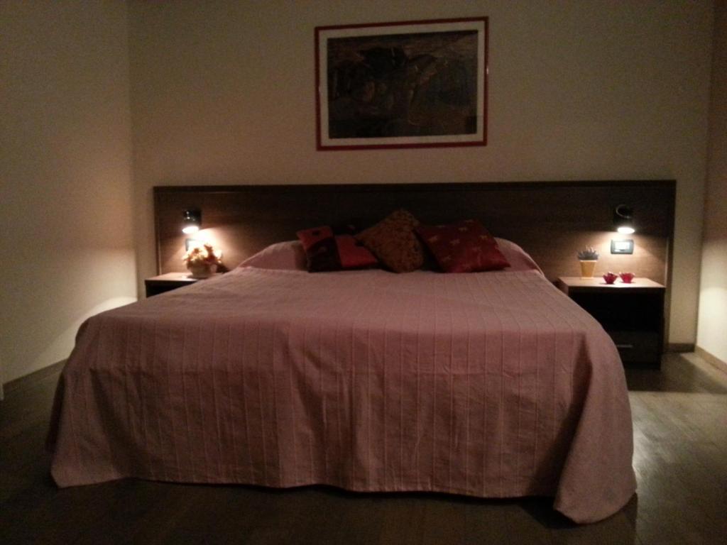 Łóżko lub łóżka w pokoju w obiekcie Hotel La Vecchia Reggio