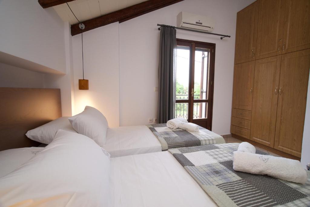 Postel nebo postele na pokoji v ubytování Tettix Summer House