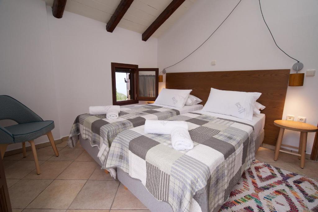 Postel nebo postele na pokoji v ubytování Tettix Summer House