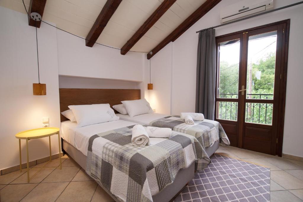 Postel nebo postele na pokoji v ubytování Tettix Summer House