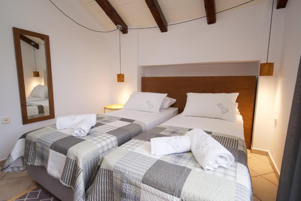 Postel nebo postele na pokoji v ubytování Tettix Summer House