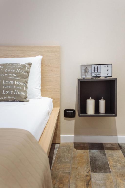 Postel nebo postele na pokoji v ubytování Politeama Luxury Suites