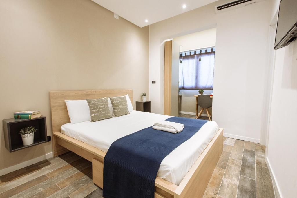 Postel nebo postele na pokoji v ubytování Politeama Luxury Suites