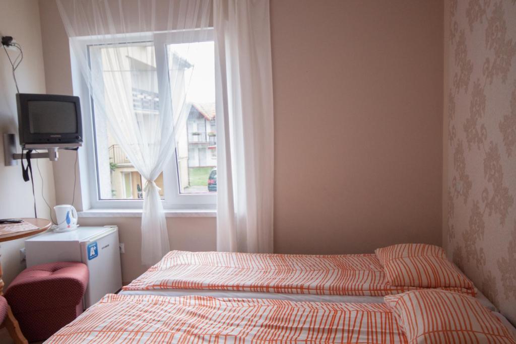 Posteľ alebo postele v izbe v ubytovaní Oaza Leba - Idealny dla rodzin z dziecmi