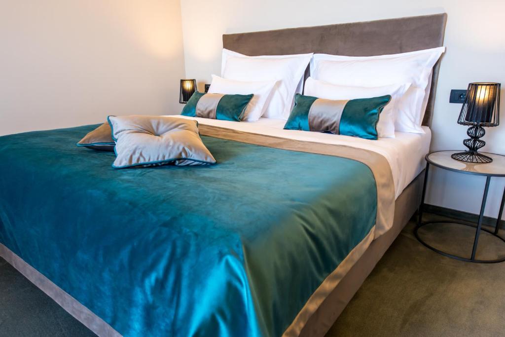 Postel nebo postele na pokoji v ubytování Boutique Hotel Acacia