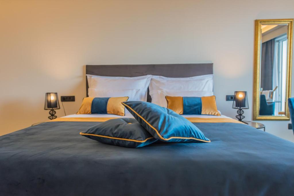 Postel nebo postele na pokoji v ubytování Boutique Hotel Acacia