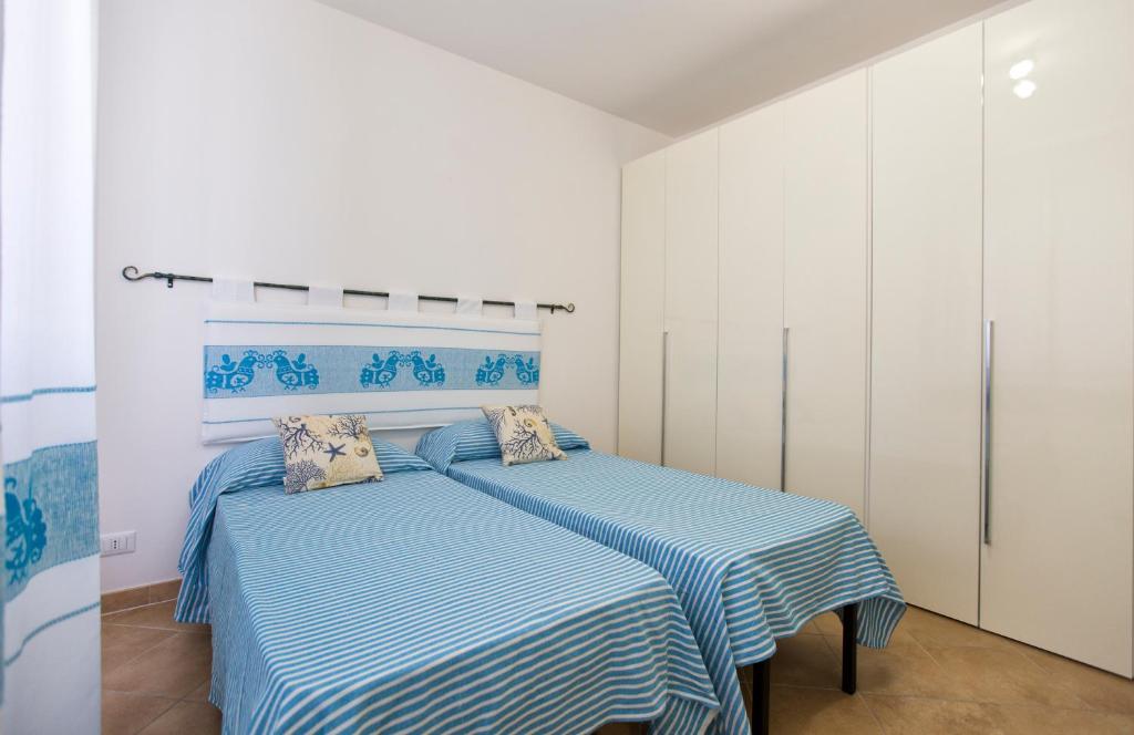 Łóżko lub łóżka w pokoju w obiekcie La Casa di Noemi