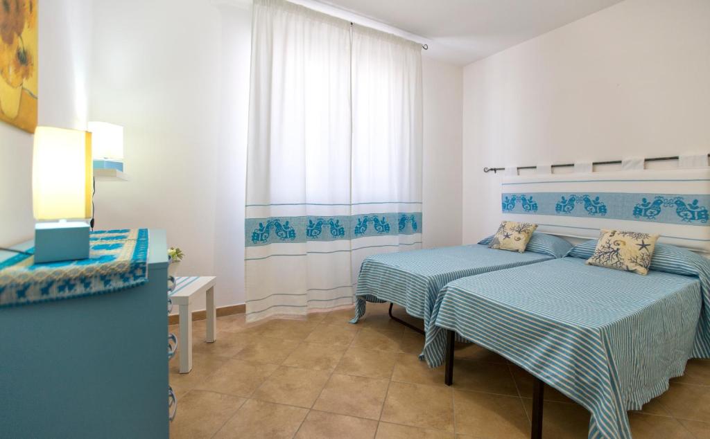 Łóżko lub łóżka w pokoju w obiekcie La Casa di Noemi