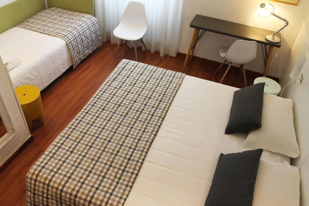 Postel nebo postele na pokoji v ubytování Hotel Bernina