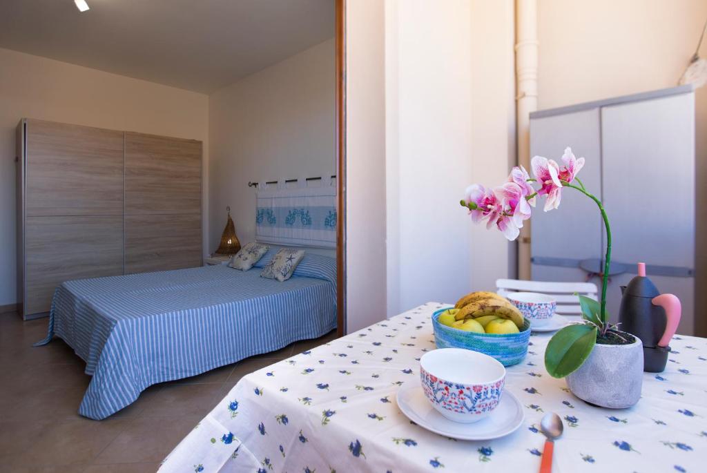 Łóżko lub łóżka w pokoju w obiekcie La Casa di Noemi