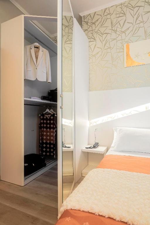 Postel nebo postele na pokoji v ubytování Hotel Ombretta Mare